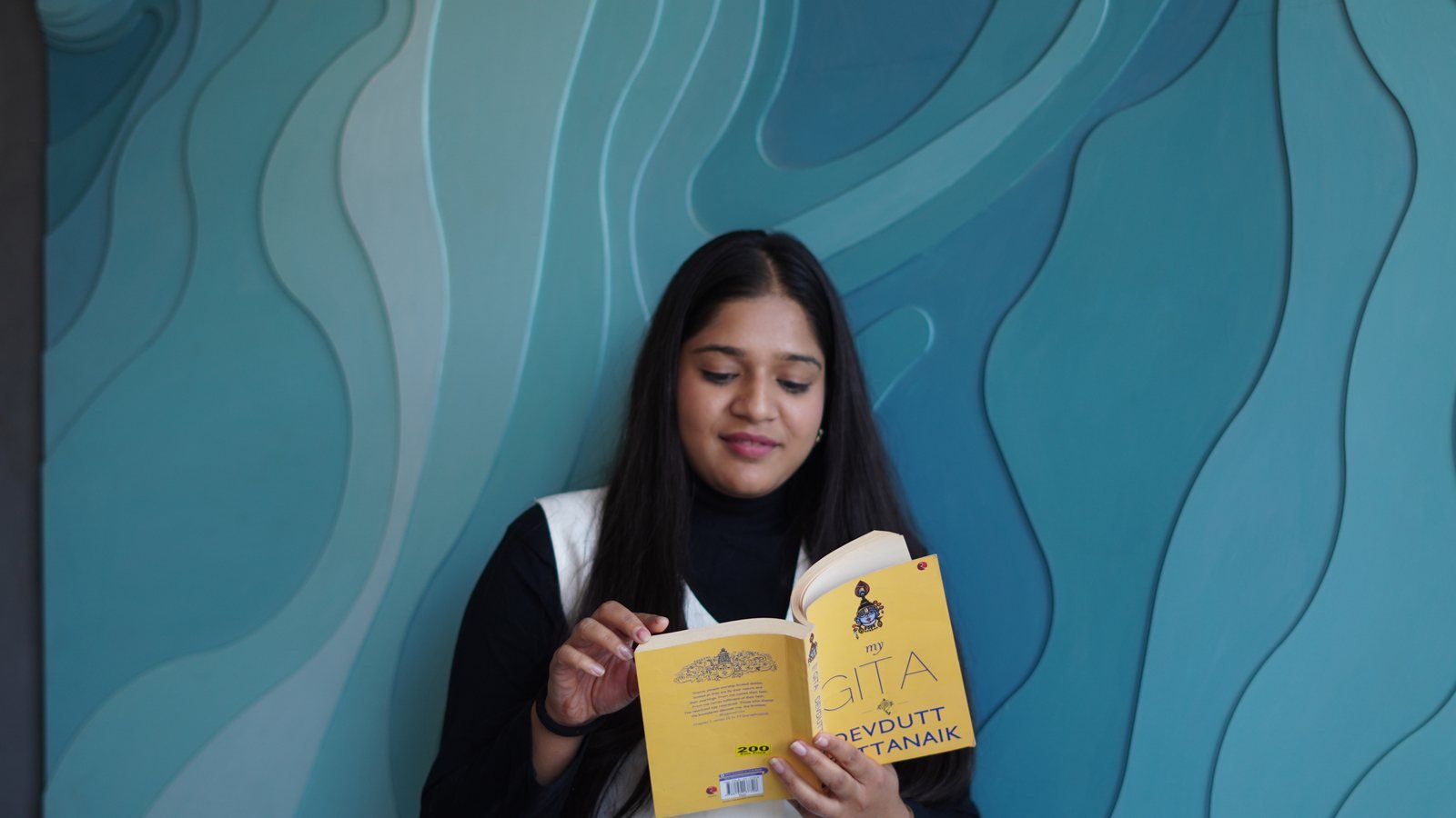 Surbhi Rawat reading a book